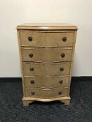 A walnut serpentine fronted five drawer chest