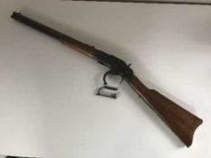A replica lever action rifle
