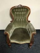 A Victorian mahogany armchair in button fabric