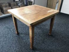 A square oak pull out dining table