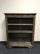 A carved oak bookcase