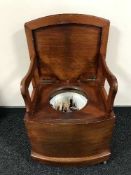 A Victorian mahogany commode chair