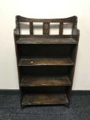A set of four Arts and Crafts open shelves
