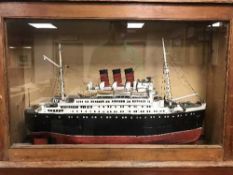 An early 20th century scratch built model boat, The Queen Mary,