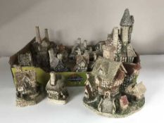 A box of eleven David Winter cottage ornaments