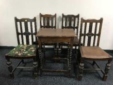An oak barley twist occasional table together with a set of four carved oak chairs