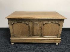A carved oak blanket chest