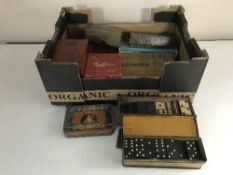 A box of assorted vintage bar games,