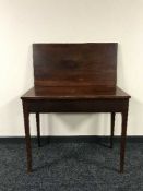 A Victorian mahogany tea table
