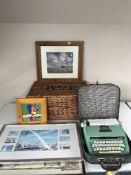 A wicker picnic basket together with a cased Petite deluxe junior typewriter together with a framed