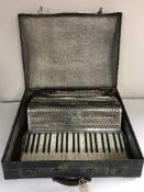 A cased piano accordion by Soprani