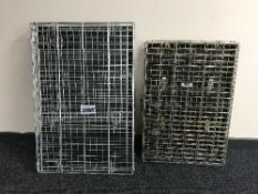 A SAVIC folding pet cage together with one other