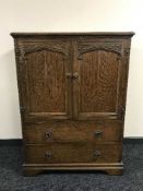 An early 20th century oak linen chest
