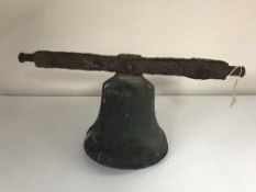An antique bell on cast iron fixing arm