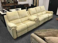 A Parker Knoll electric reclining three seater settee and matching two seater settee (less than