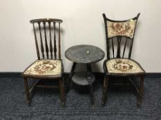 A carved ebonised occasional table and two mahogany bedroom chairs