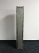 A metal gun cabinet with keys