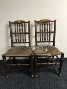 A pair of antique oak rush seated country chairs