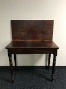 A Victorian mahogany tea table