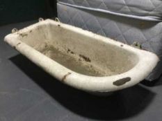 A white enamelled cast iron wall mounted planter