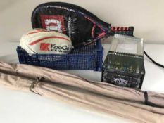 Two three piece split cane fishing rods in carry bags together with two Wilson racquet-ball rackets,