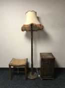 A carved oak bedside cabinet,