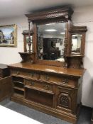 A late Victorian oak mirror backed sideboard
