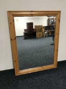 A contemporary pine framed bevelled mirror