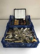 A quantity of boxed and loose cutlery