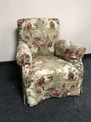 An early 20th century armchair in loose cover