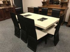 A Barker and Stonehouse contemporary dining room table on twin pedestal support,