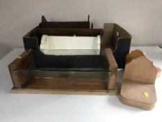 A box of seven assorted wooden book troughs