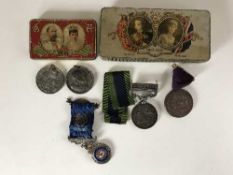 Two Coronation commemorative tins containing silver RAOB medal,