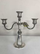 A silver three way candelabra,