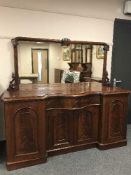 A Victorian inverted breakfront mahogany mirror back sideboard