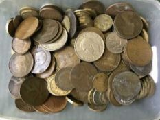 A box containing a quantity of pre decimal British coins