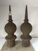 A pair of cast iron antique finials