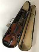 An early 20th century violin and bow in coffin case