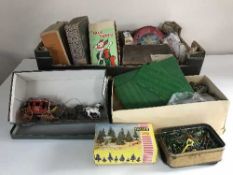 A box of vintage jigsaws, Rubix cubes, doll's tea set, miniature dolls,