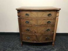 A bow-fronted four drawer chest