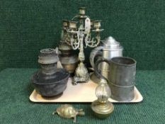 A pewter pint jug, brass candelabrum,