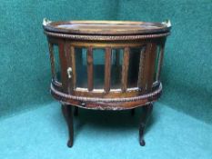 A mahogany glazed stand with lift off butler's tray top