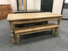 A Victorian style pine farmhouse table and pair of matching benches,