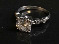 A large antique solitaire diamond ring in platinum, the central stone approximately 1.7 ct.