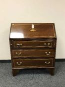 An Edwardian inlaid mahogany bureau,
