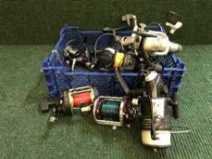 A basket of assorted fishing reels