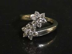 A 9ct gold diamond double cluster ring, approximately 0.5ct.
