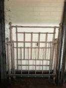 A Victorian brass bed with irons