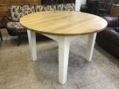 A circular pine dining table