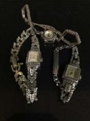 A silver marcasite wrist watch together with two other similar watches (3)